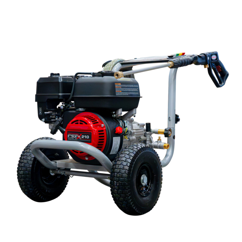 Simpson MegaShot MS61472 gas pressure washer featuring a red CRX210 engine, OEM Technologies axial cam pump, silver welded steel frame, and 10-inch pneumatic tires on a black background.