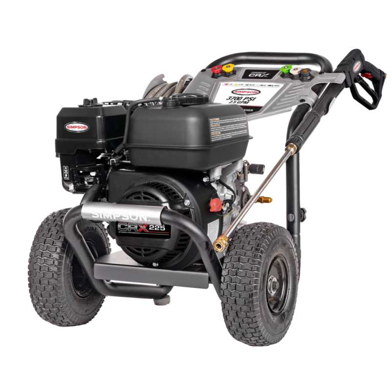 Alt Text: Simpson PowerShot PS61254 professional gas pressure washer featuring a black CRX225 engine, a AAA AX500 Pro axial cam pump, a black powder-coated steel frame, a silver dashboard console, and 10-inch premium pneumatic tires on a black background.