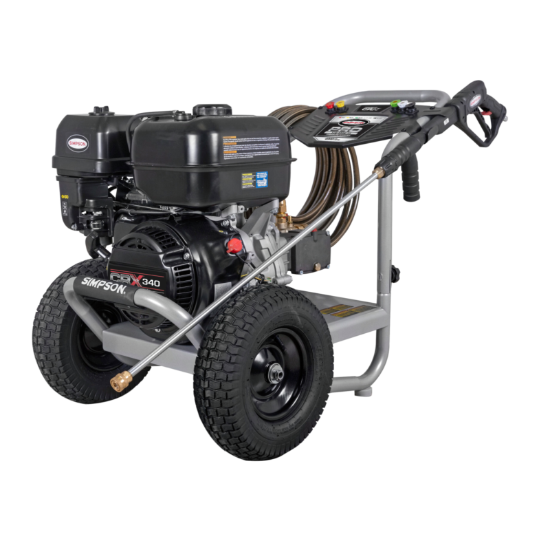 Alt Text: Simpson Pro Series PS61323 commercial gas pressure washer featuring a black CRX340 engine, a premium triplex plunger pump, a silver powder-coated welded steel frame, a black dashboard console, and pneumatic transport tires.