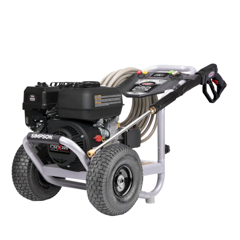 Alt Text: Simpson Pro Series PS61370 professional gas pressure washer featuring a black CRX225 engine, a AAA triplex plunger pump, a silver powder-coated steel frame, a black dashboard console, and 10-inch premium pneumatic tires on a black background.