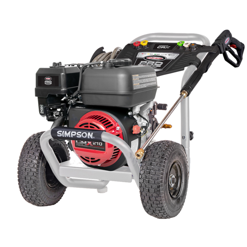 Simpson Pro Series PS61374 gas pressure washer featuring a red-shrouded CRX210 engine, an aluminum-colored welded steel frame, a black dashboard console, and 10-inch premium pneumatic tires on a black background.